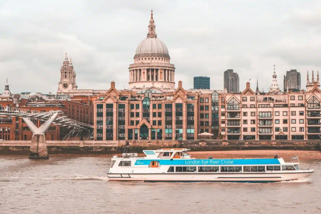 The 6 Best Things to Do in London A London Eye River Cruise sailing on the River Thames in front of St Paul's Cathedral.