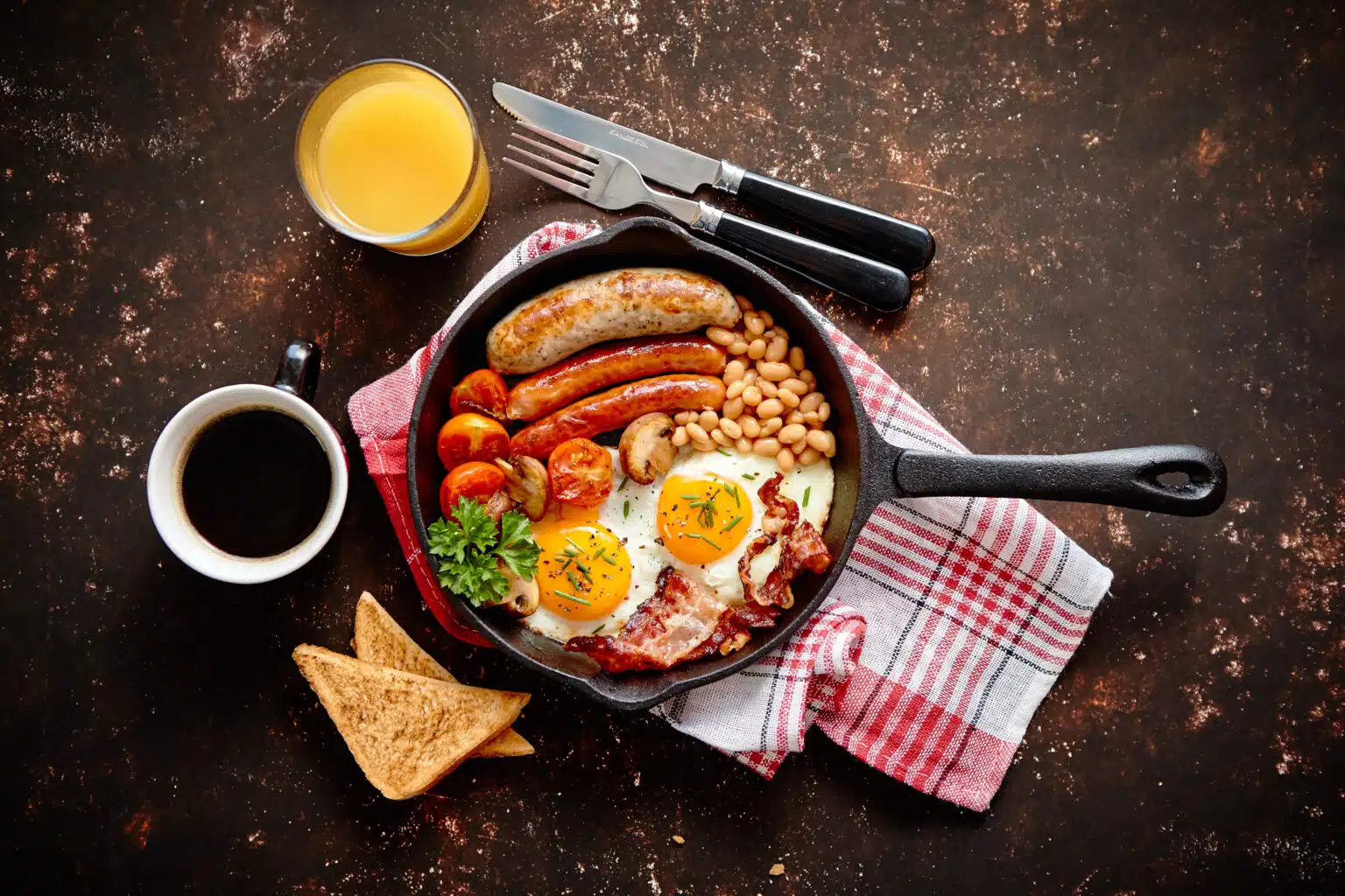 Where to Find London's Best Breakfast Full English breakfast served in a frying pan.
