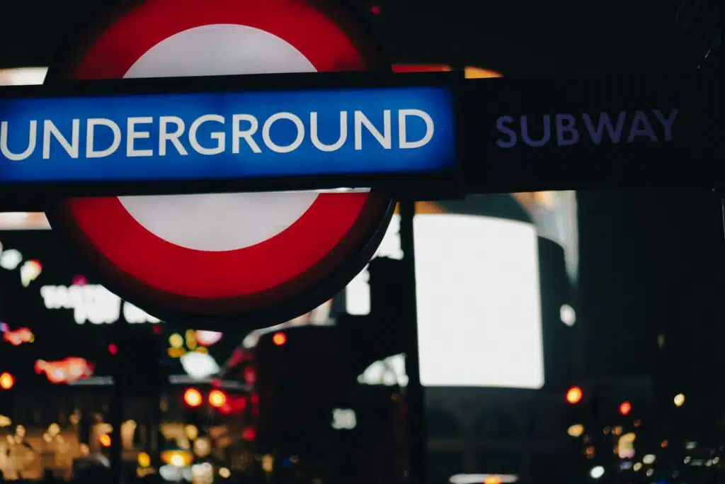The London Night Tube — Saving Your Weekend Since 2016 London Underground sign at night.